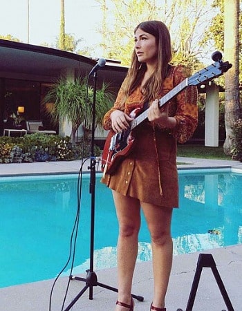 Jade Castrinos is looking cute in the brown dress while holding the guitar. Who is Jade's husband? 